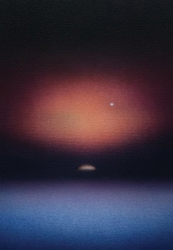 A blurry picture of the moon hanging in the bleak darkness of space.