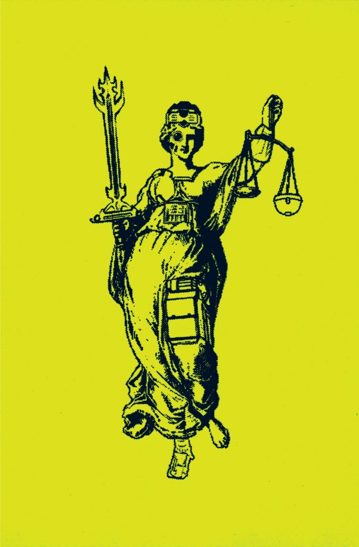 Lady Justice lifts her scales into the air with one hand and a giant sword befit of a fantasy video game with the other. She has something robotic attached to her thigh, and is wearing what appears to be a gadget akin to VR goggles as a makeshift crown.